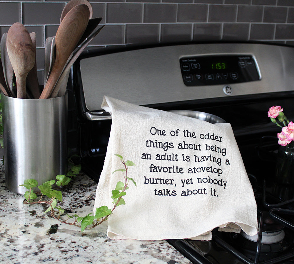One of the odder things about being an adult is having a favorite stovetop burner, yet nobody talks about it funny kitchen tea towel