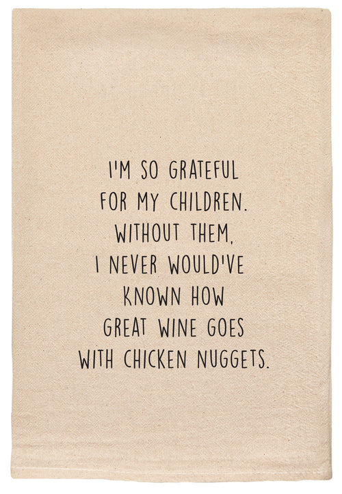 I'm so grateful for my children. Without them, I never would've known how great wine goes with chicken nuggets kitchen tea towel