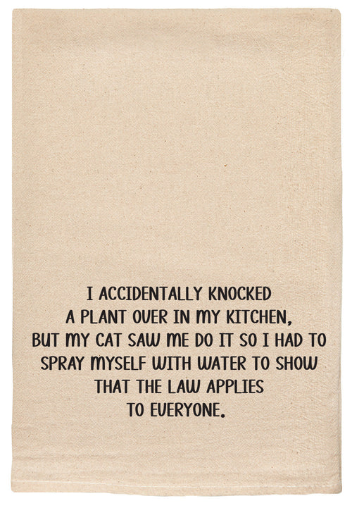 I accidentally knocked over a plant in my kitchen, but my cat saw me do it so I had to spray myself with water to show that the law applies to everyone. natural kitchen tea towel