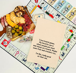 I love board games. My favorite one is where people put meat and cheese on a board. Maybe some fruit and crackers too. I'm like, really good at that one. - kitchen tea towel