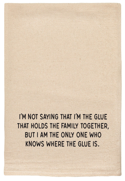Natural kitchen towel with printed text 'I'm not saying that I'm the glue that holds the family together, but I am the only one who knows where the glue is.' printed in black ink.