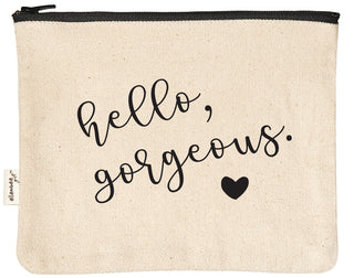 Canvas makeup bag printed with "hello gorgeous" in black text.