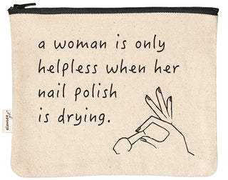 Canvas makeup bag printed with "A woman is only helpless when her nail polish is drying" in black text.