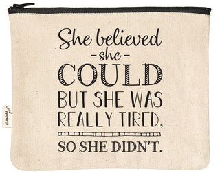 Canvas zipper pouch printed with "she believed she could but she was really tired so she didn't" in black text.