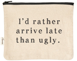 Canvas makeup bag printed with "I'd rather arrive late than ugly" in black text.