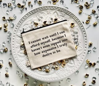 Lifestyle image of a zipper pouch that says "I cannot wait until I can afford myself" 
