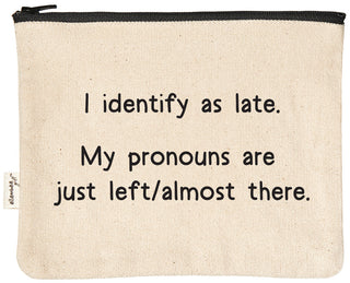 Natural canvas zipper pouch with a black YKK zipper, printed in black with "I identify as late. My pronouns are just left/almost there."