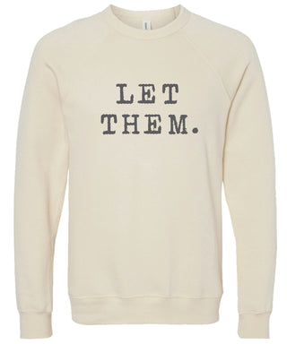 Cream sweatshirt with 'Let them.' text printed in gray ink.