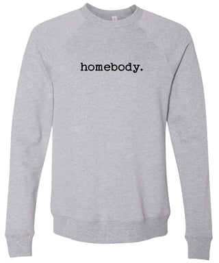 Light gray sweatshirt with 'homebody.' text in black ink.
