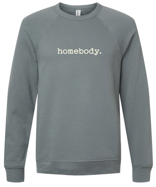 Storm colored sweatshirt with 'homebody.' text printed in cream ink.