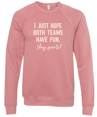 Pink sweatshirt with text 'I just hope both teams have fun. Yay sports!' printed in cream ink.