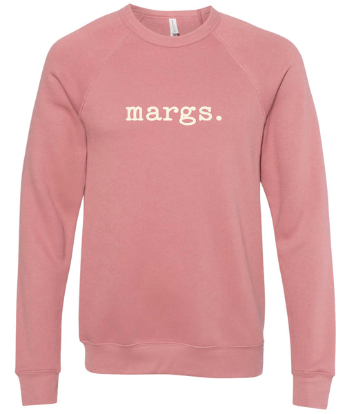 Pink sweatshirt with 'margs.' text printed in cream ink.