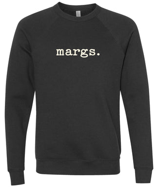 Black sweatshirt with 'margs.' text printed in cream ink.