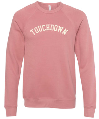 Pink sweatshirt with 'TOUCHDOWN' text printed in cream ink.