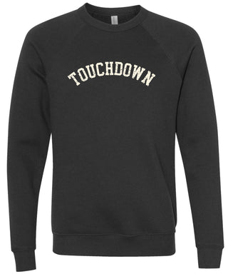 Black sweatshirt with 'TOUCHDOWN' text printed in cream ink.
