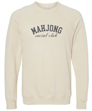 Cream sweatshirt with 'MAHJONG social club' text printed in gray ink.