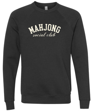 Black sweatshirt with 'MAHJONG social club' text printed in cream ink.