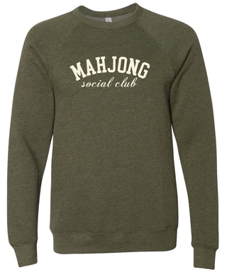 Olive green sweatshirt with 'MAHJONG social club' text printed in cream ink.