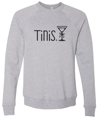 Gray sweatshirt with 'Tinis.' text and martini glass graphic printed in black ink.