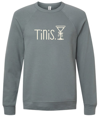Storm sweatshirt with 'Tinis.' text and martini glass graphic printed in cream ink.