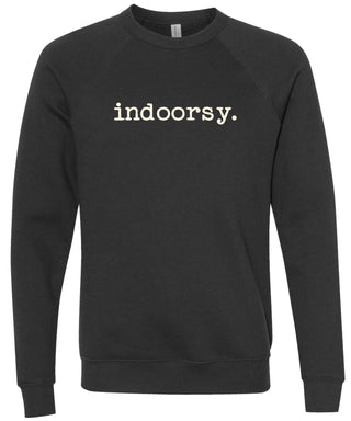 Black sweatshirt with 'indoorsy.' text printed in cream ink.