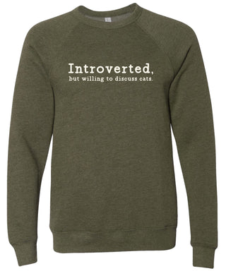 Moss sweatshirt with text 'Introverted, but willing to discuss cats' printed in cream ink.