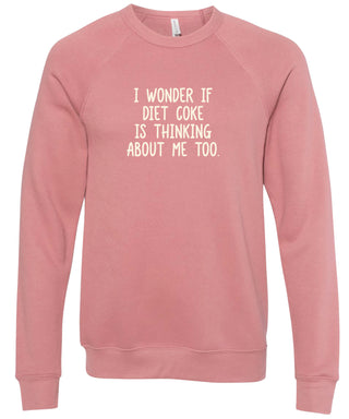 Pink sweatshirt with text 'I wonder if Diet Coke is thinking about me too' printed in cream ink.