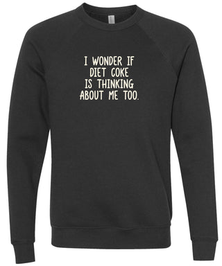 Black sweatshirt with text 'I wonder if Diet Coke is thinking about me too' printed in cream ink.