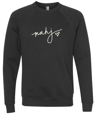 Black sweatshirt with 'mahj' text with heart design in cream ink.
