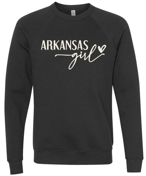 Heather black sweatshirt with 'Arkansas state girl' text printed in cream ink.