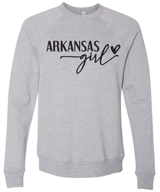 Heather gray colored sweatshirt with 'Arkansas state girl' text printed in black ink.