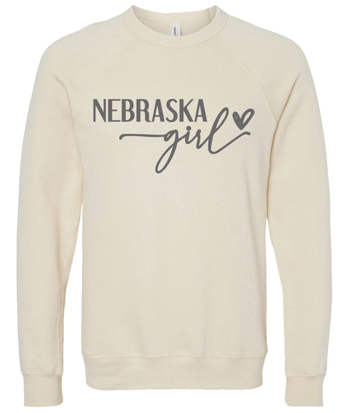 Cream sweatshirt with 'Nebraska girl' printed in gray ink.