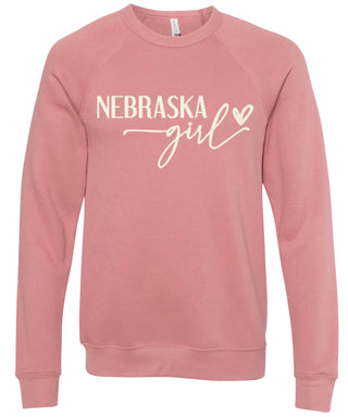 Dusty rose sweatshirt with 'Nebraska girl' printed in cream ink.