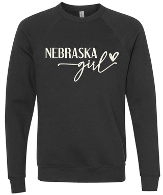 Black sweatshirt with 'Nebraska girl' printed in cream ink.
