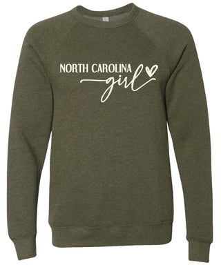 Heather olive sweatshirt with 'North Carolina girl' printed in cream ink.
