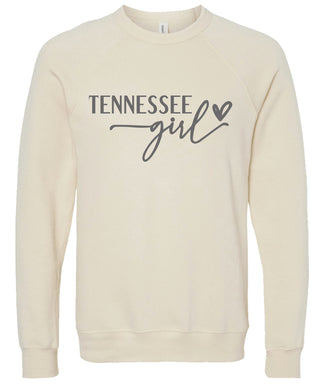 Cream sweatshirt with 'Tennessee girl' printed in gray ink.