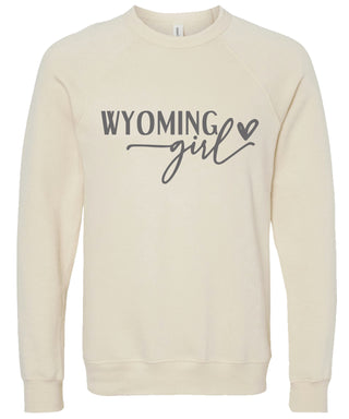 Cream sweatshirt with 'Wyoming girl' printed in gray ink.