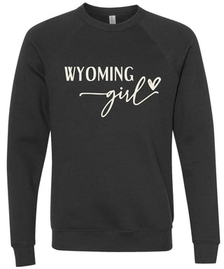 Black sweatshirt with 'Wyoming girl' printed in cream ink.