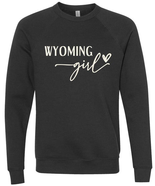 Black sweatshirt with 'Wyoming girl' printed in cream ink.
