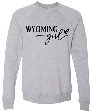 Gray sweatshirt with 'Wyoming girl' printed in black ink.