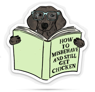 Sticker of a dog reading a book titled 'How to Misbehave and Still Get Chicken' on a white background.