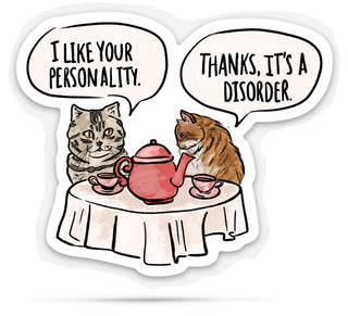 Funny hand drawn sticker of Two cats at a table with a teapot, one saying 'I like your personality.' and the other responding 'Thanks, it's a disorder.'