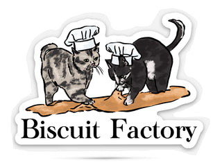 Sticker with cats kneading dough with humorous text that reads 'Biscuit factory' on a white background.