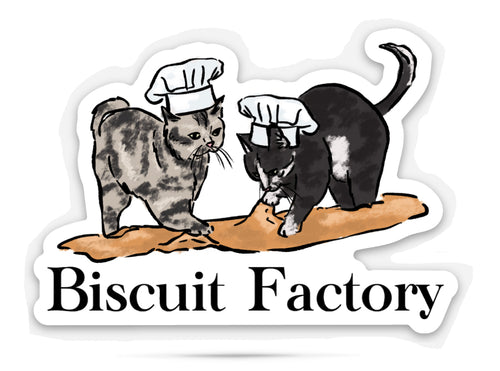 Sticker with cats kneading dough with humorous text that reads 'Biscuit factory' on a white background.