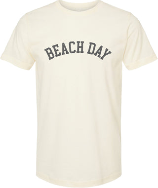 Cream t-shirt with 'Beach day' printed in gray ink.