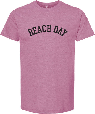 Raspberry t-shirt with 'Beach day' printed in black ink.
