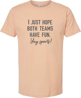 Peach t-shirt with 'I just hope both teams have fun. Yay sports!' printed in gray ink.