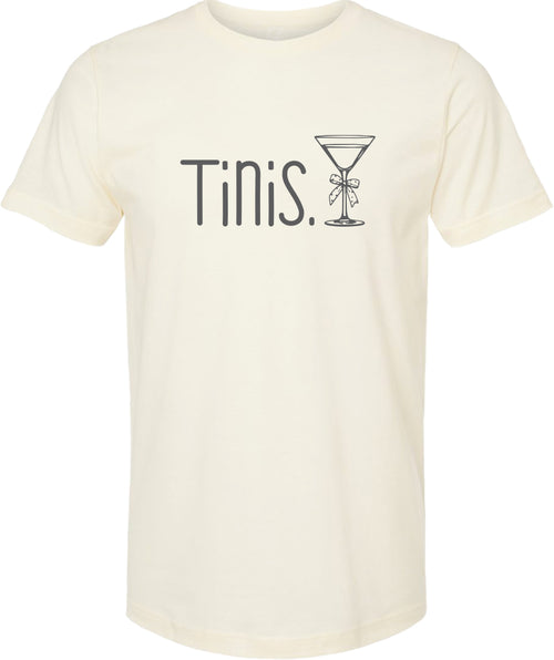 Cream t-shirt with 'Tinis.' and a martini glass graphic printed in gray ink.