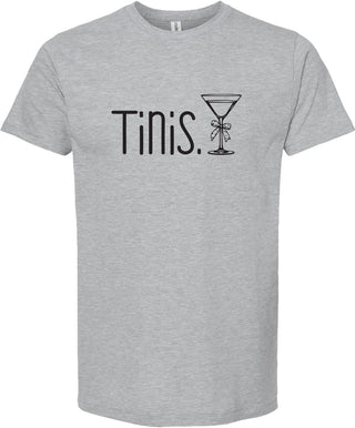 Light gray t-shirt with 'Tinis.' and a martini glass graphic printed in black ink.