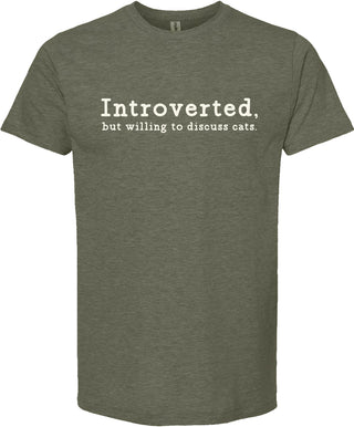 Moss colored t-shirt with text 'Introverted, but willing to discuss cats' printed in cream ink.